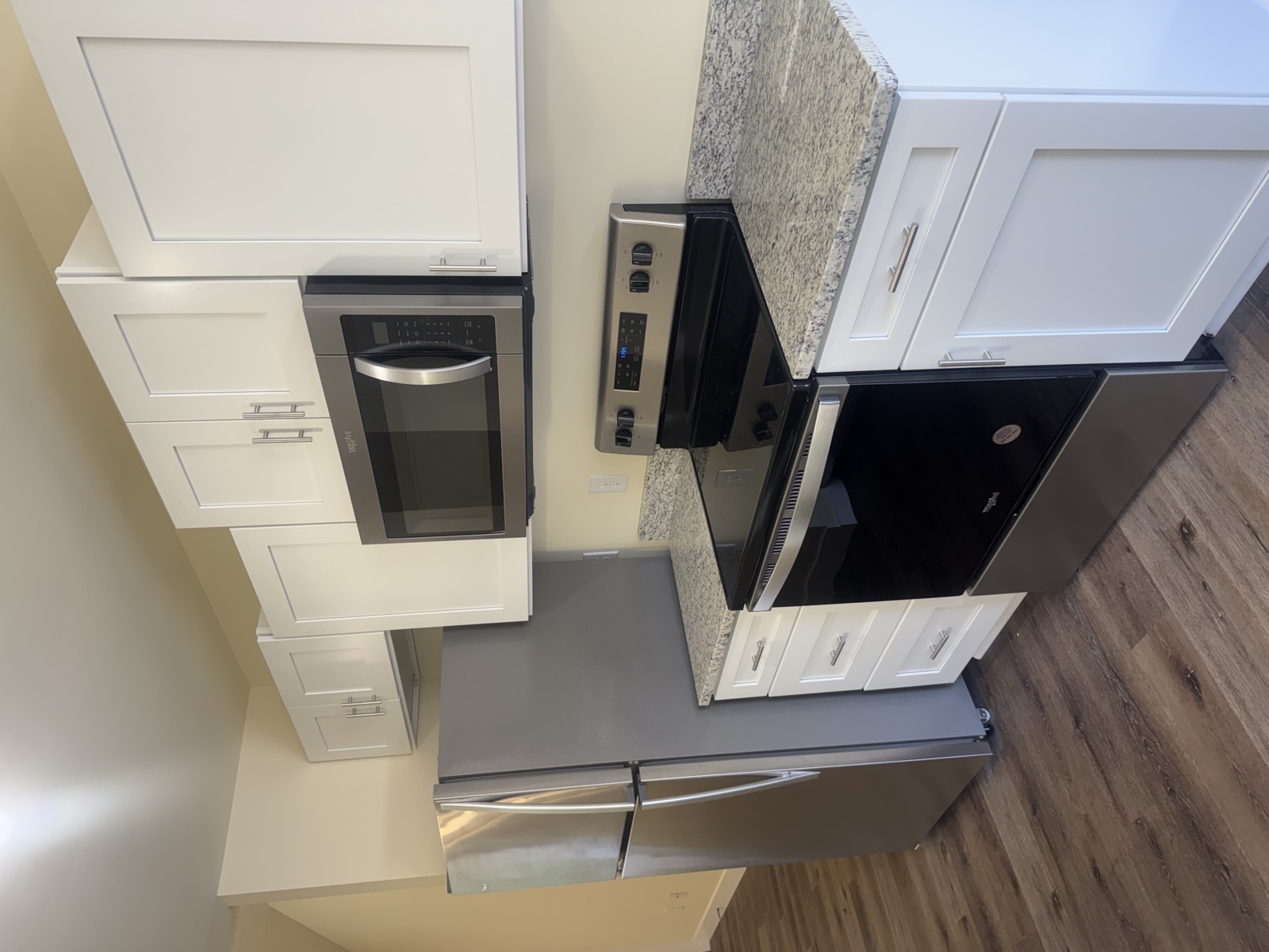 Renovated kitchen with granite counters and stainless appliances