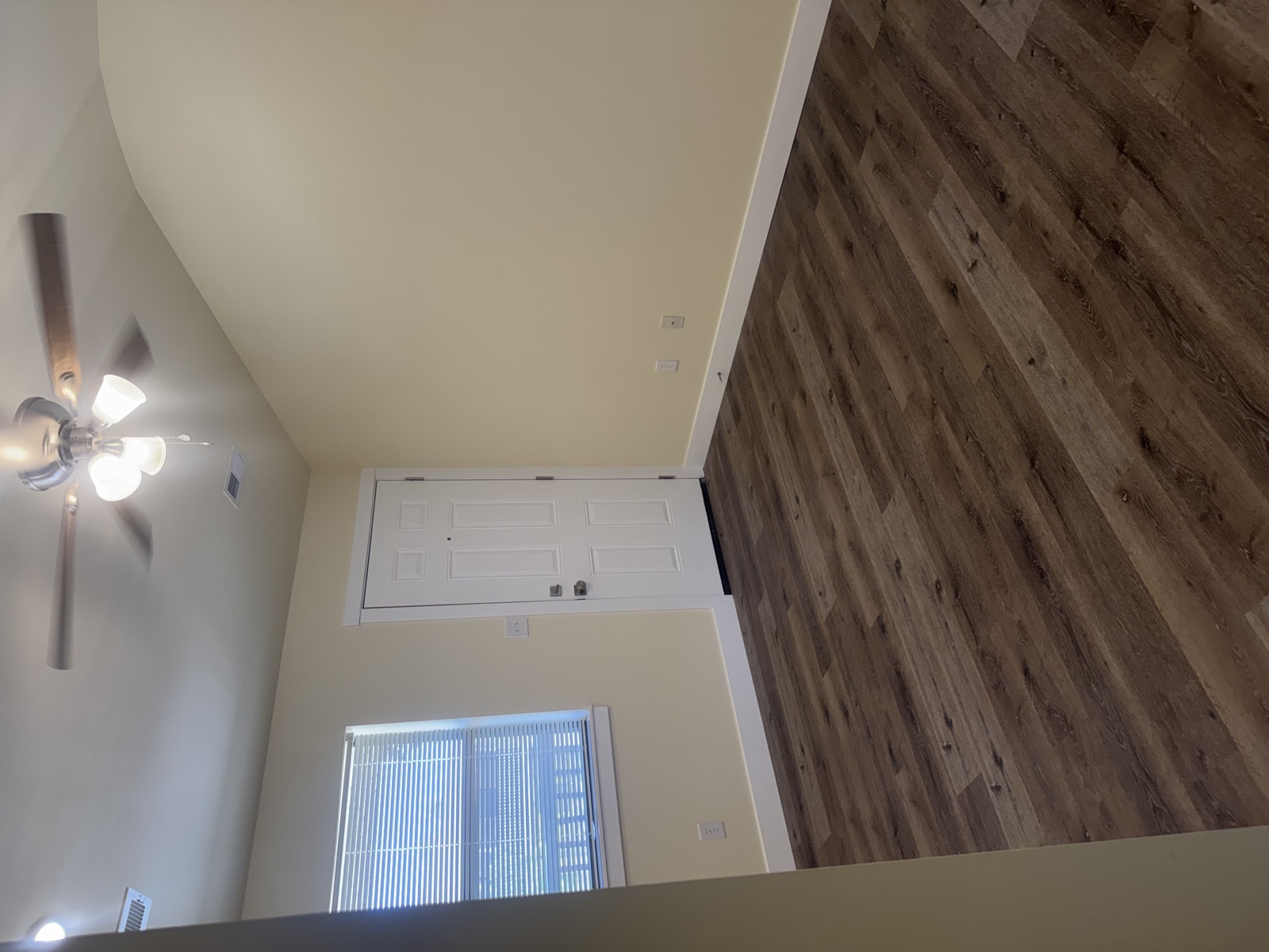 Living room with ceiling fan and wood-style flooring
